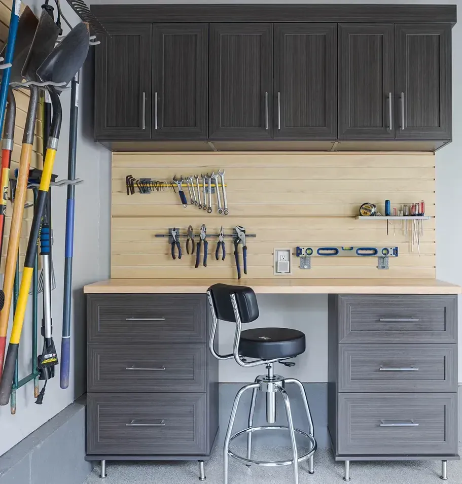 Walk-in closet with wooden shelves, clothes, luggage, and shoes.