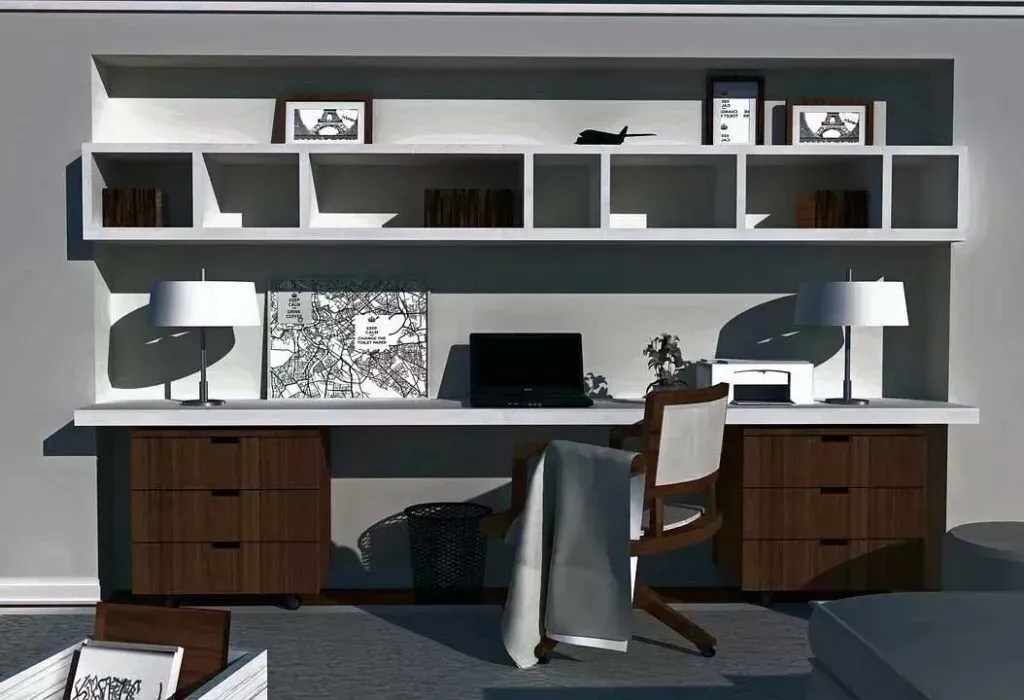 A modern home office with a floating white desk, dual dark-wood storage pedestals, and white shelving against a gray wall.