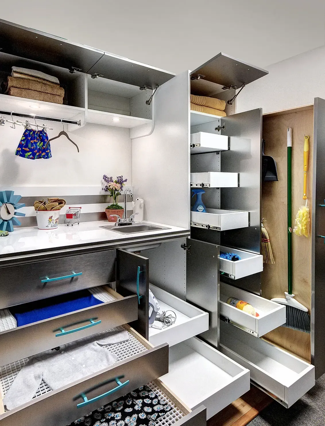 White kitchen cabinets with shelves, storing food items, wine bottles, and a red mixer, next to a wood-topped island.
