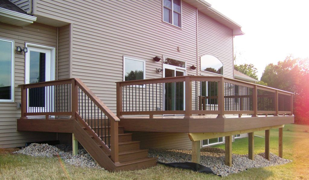 A house with a large deck and stairs