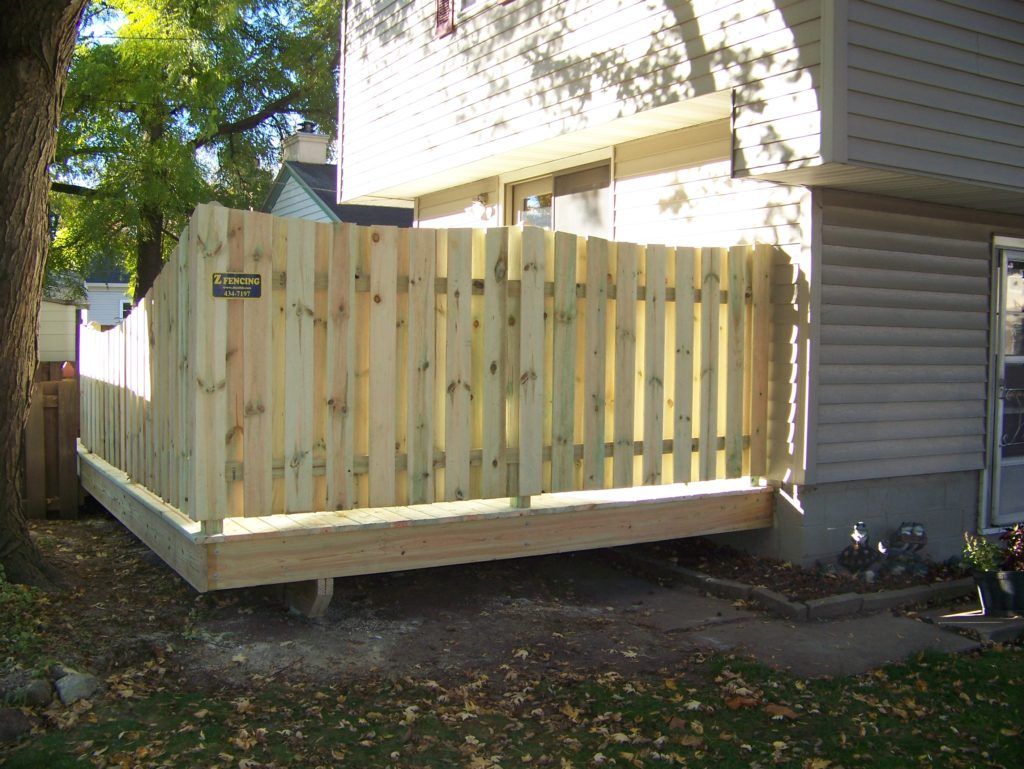 a wooden privacy fence on a house