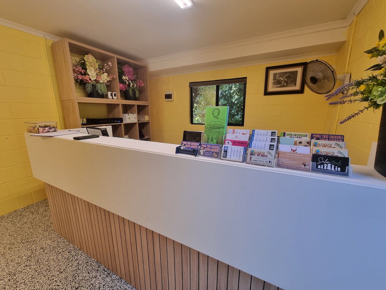 Reception Desk in a Room With Yellow Walls — Four Way Kennels & Canine Wellness Centre in Kinkuna, QLD