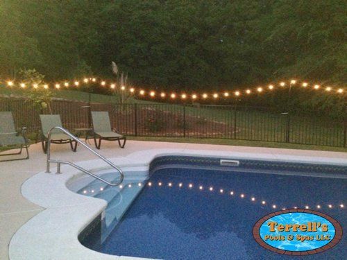 A swimming pool with a sign that says terral 's pool & spa