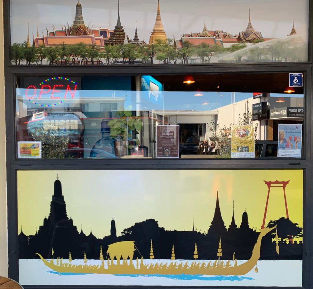 A restaurant with a sign that says ' open ' on it