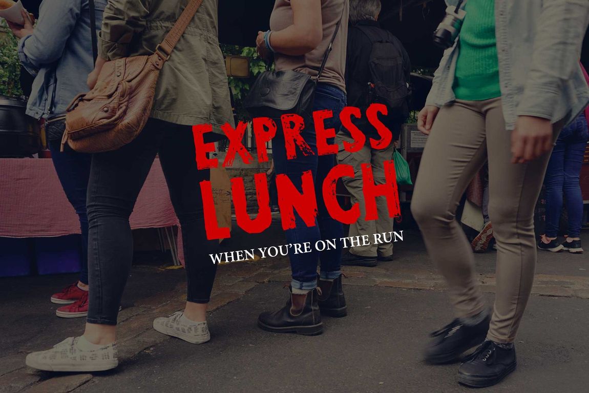 A group of people are standing in a line at an express lunch.