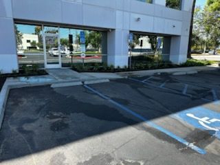 A handicapped parking spot in front of a building