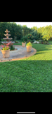There is a fountain in the middle of the lawn.