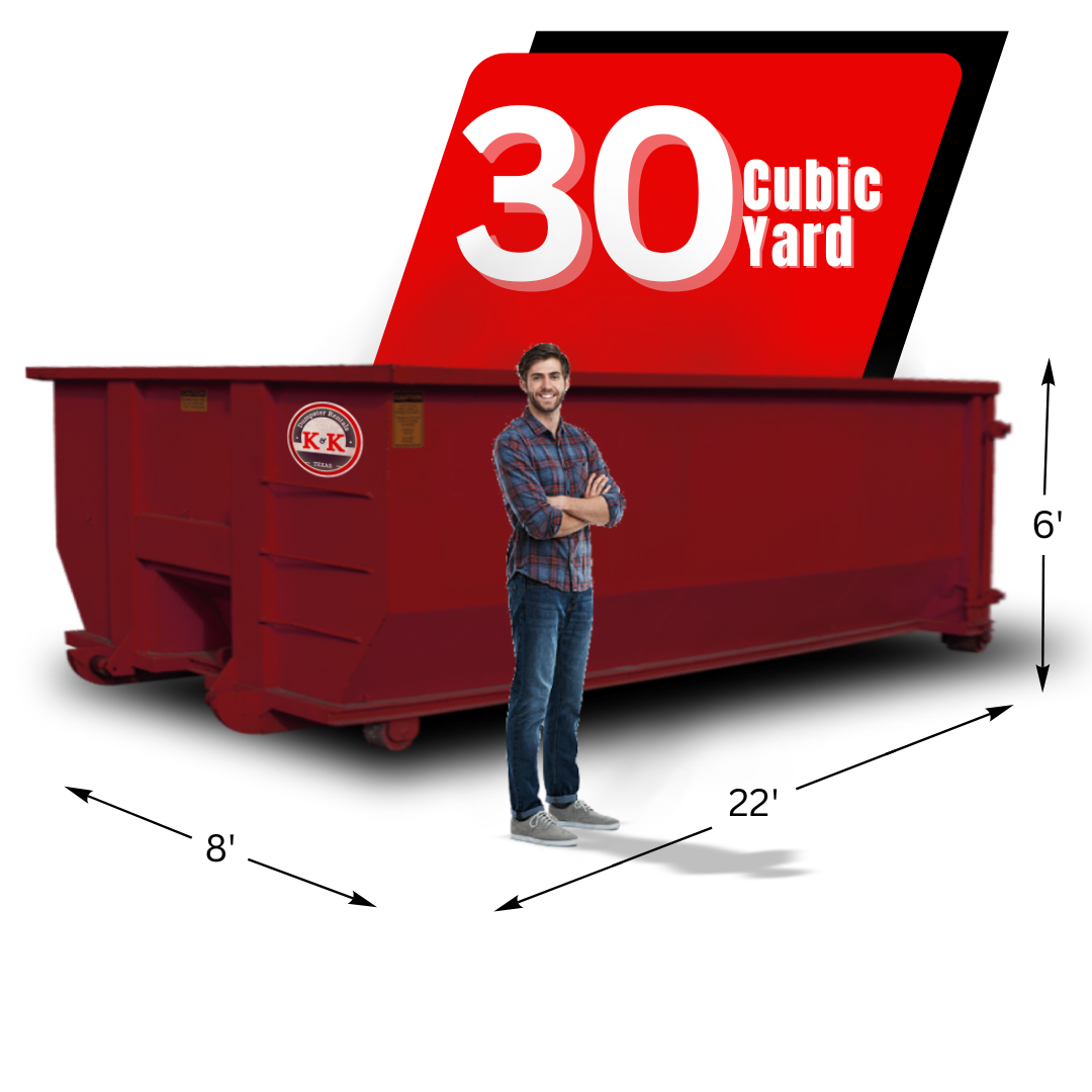 K&K Dumpster with man in front of it.