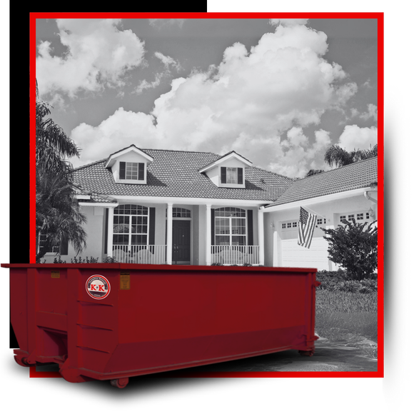 K&K Dumpster in front of a house.