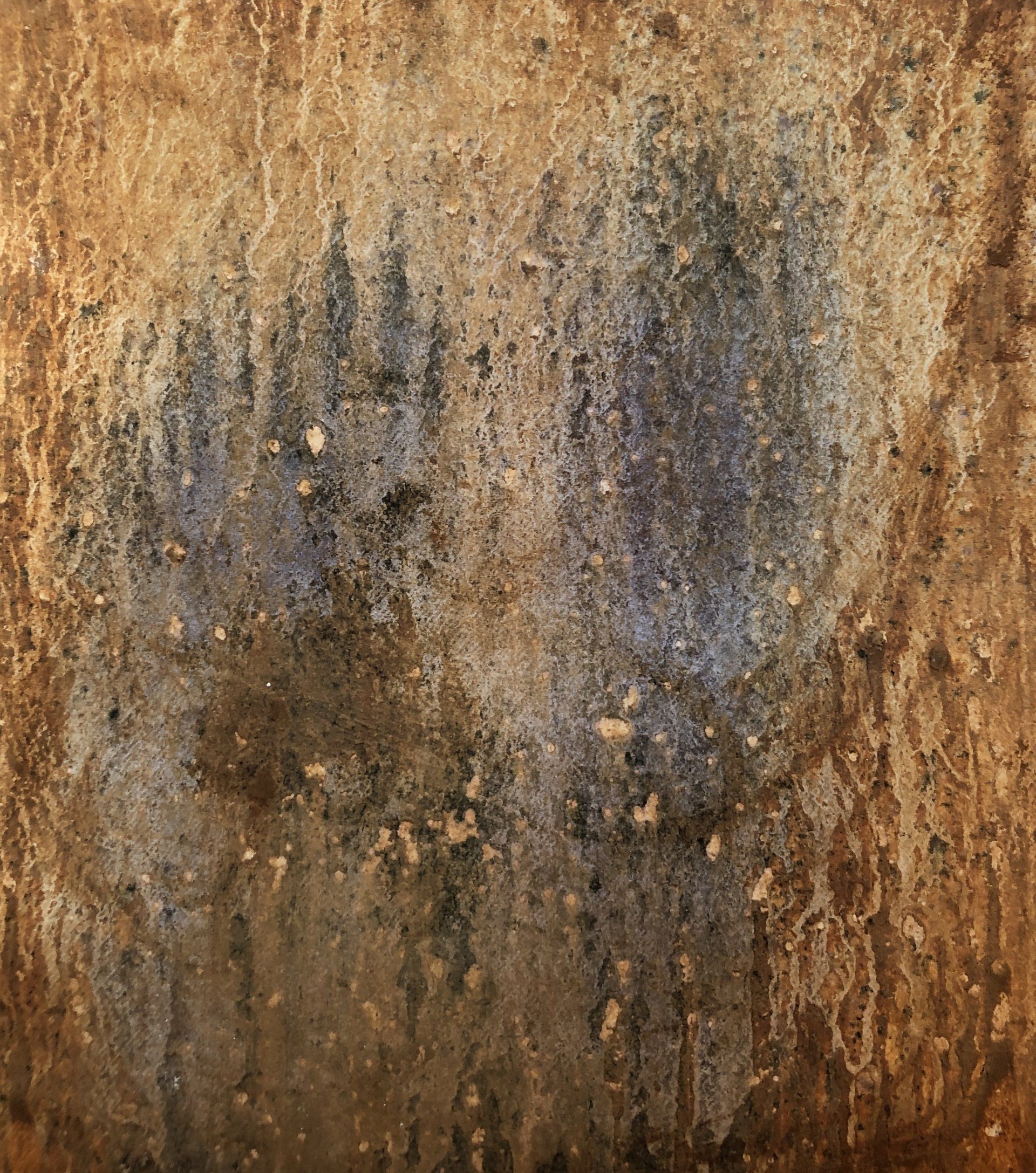 A close up of a rusty metal surface