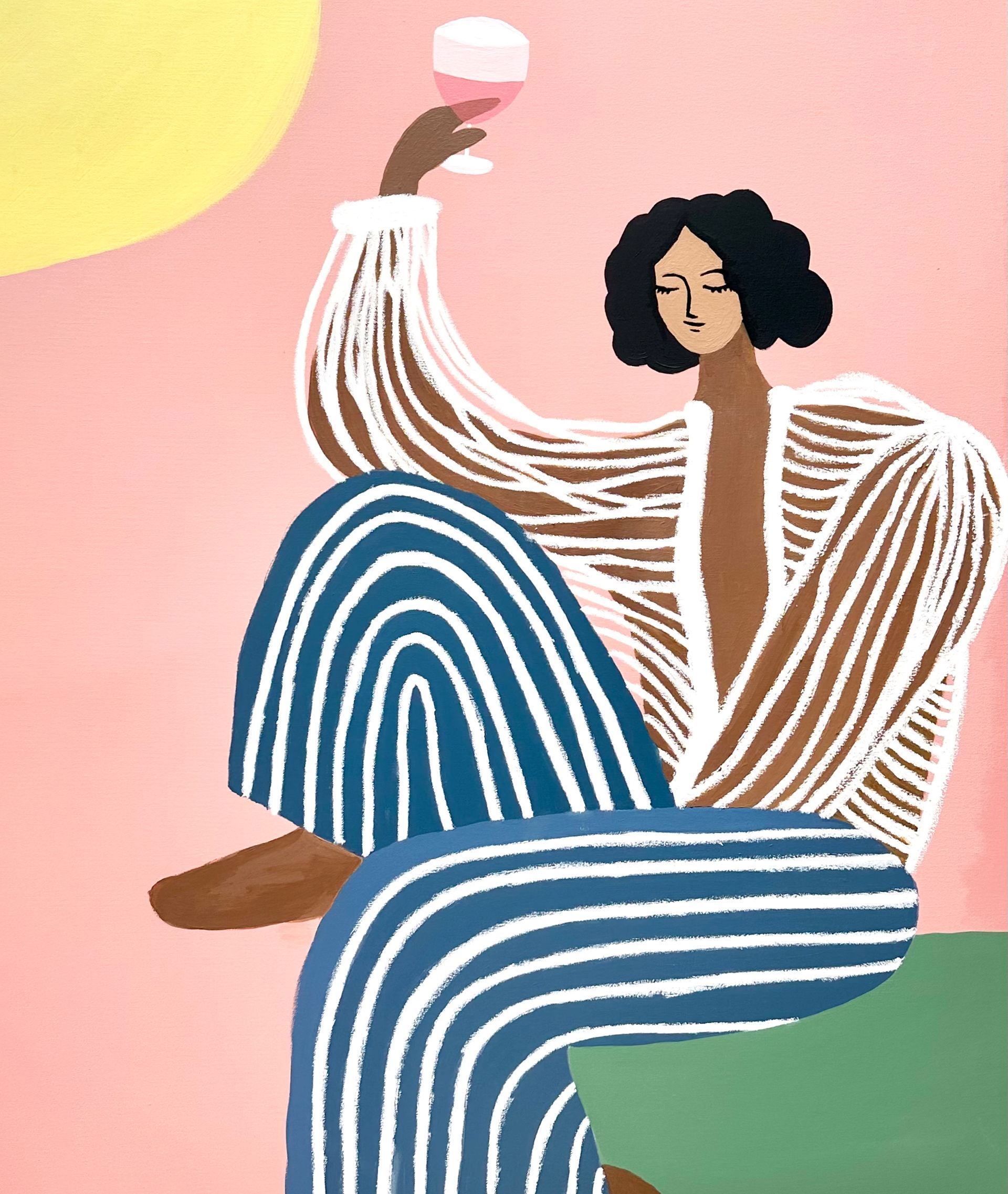 A woman in striped pants is holding a glass of wine