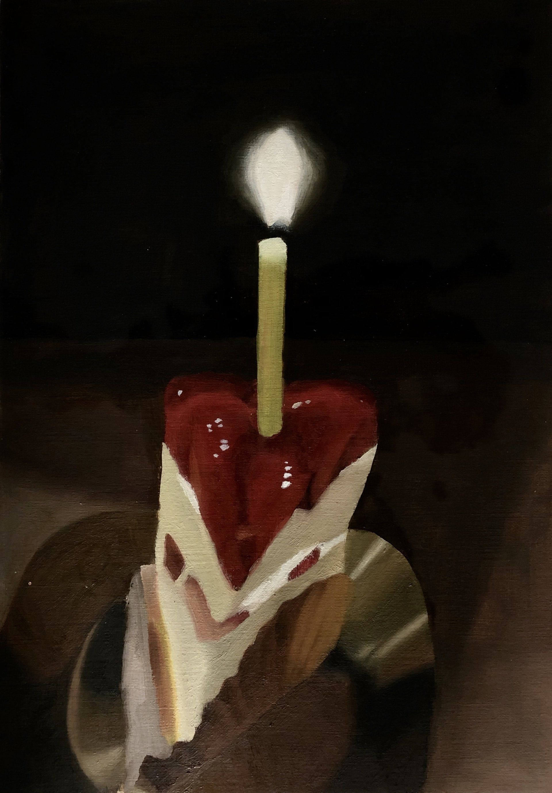 A piece of cake with a candle on top of it