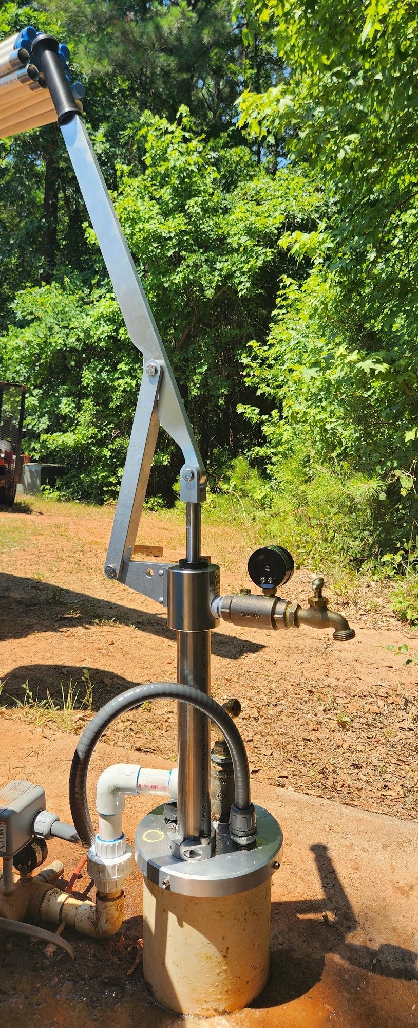 Three water tanks are sitting next to each other in cardboard boxes