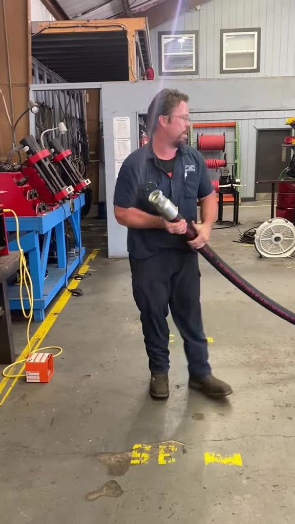 Man Holding Large Hose — Clearwater, FL — Hose & Hydraulic