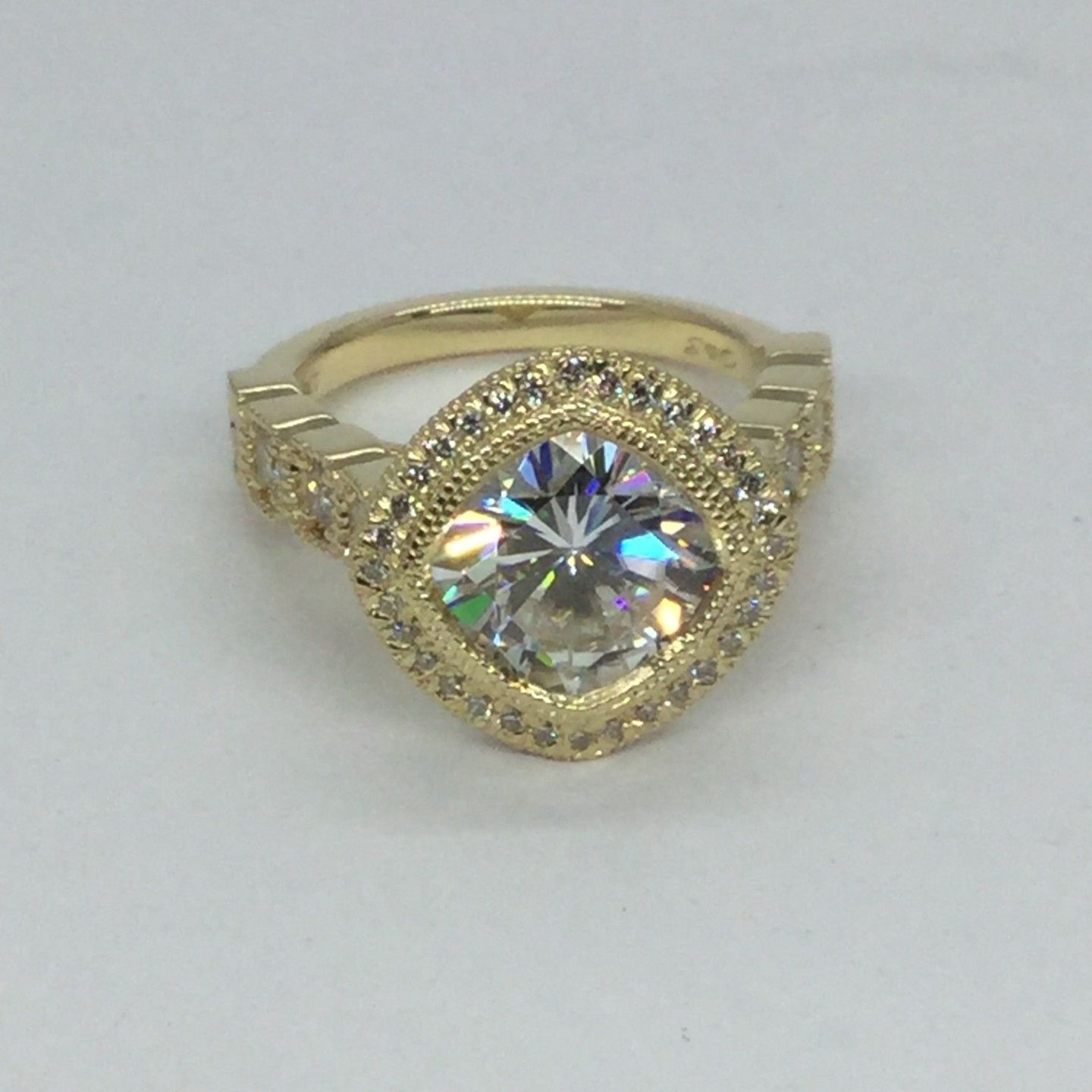 A gold ring with a diamond in the center