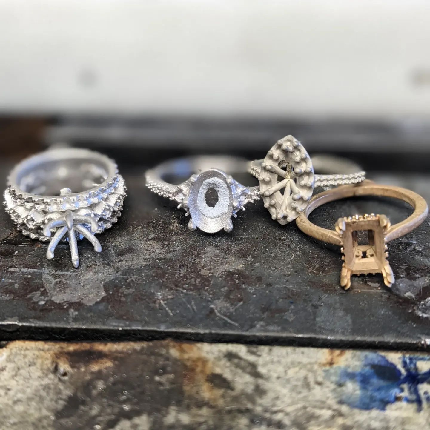 Three rings are sitting on top of each other on a table.