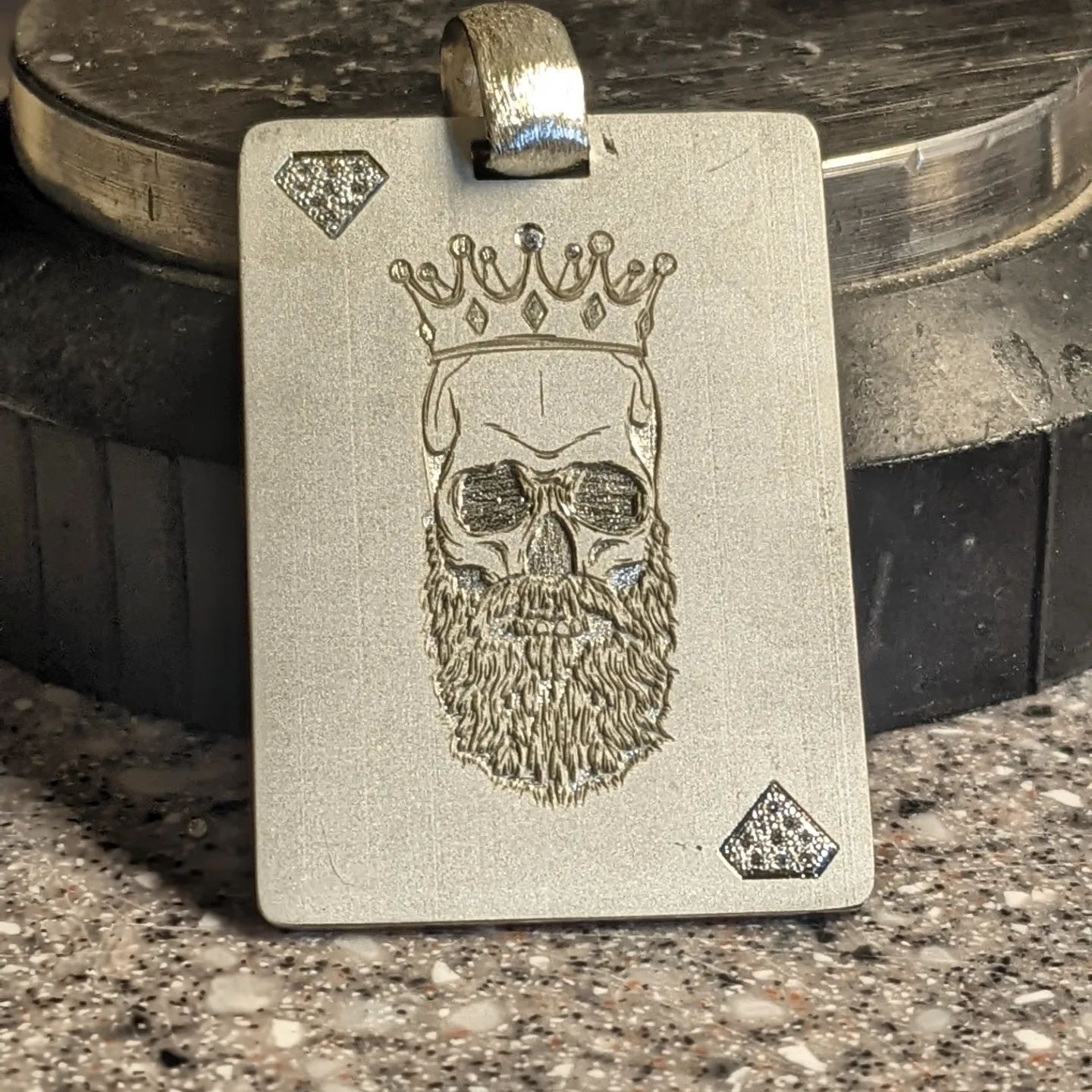 A playing card with a skull and beard on it