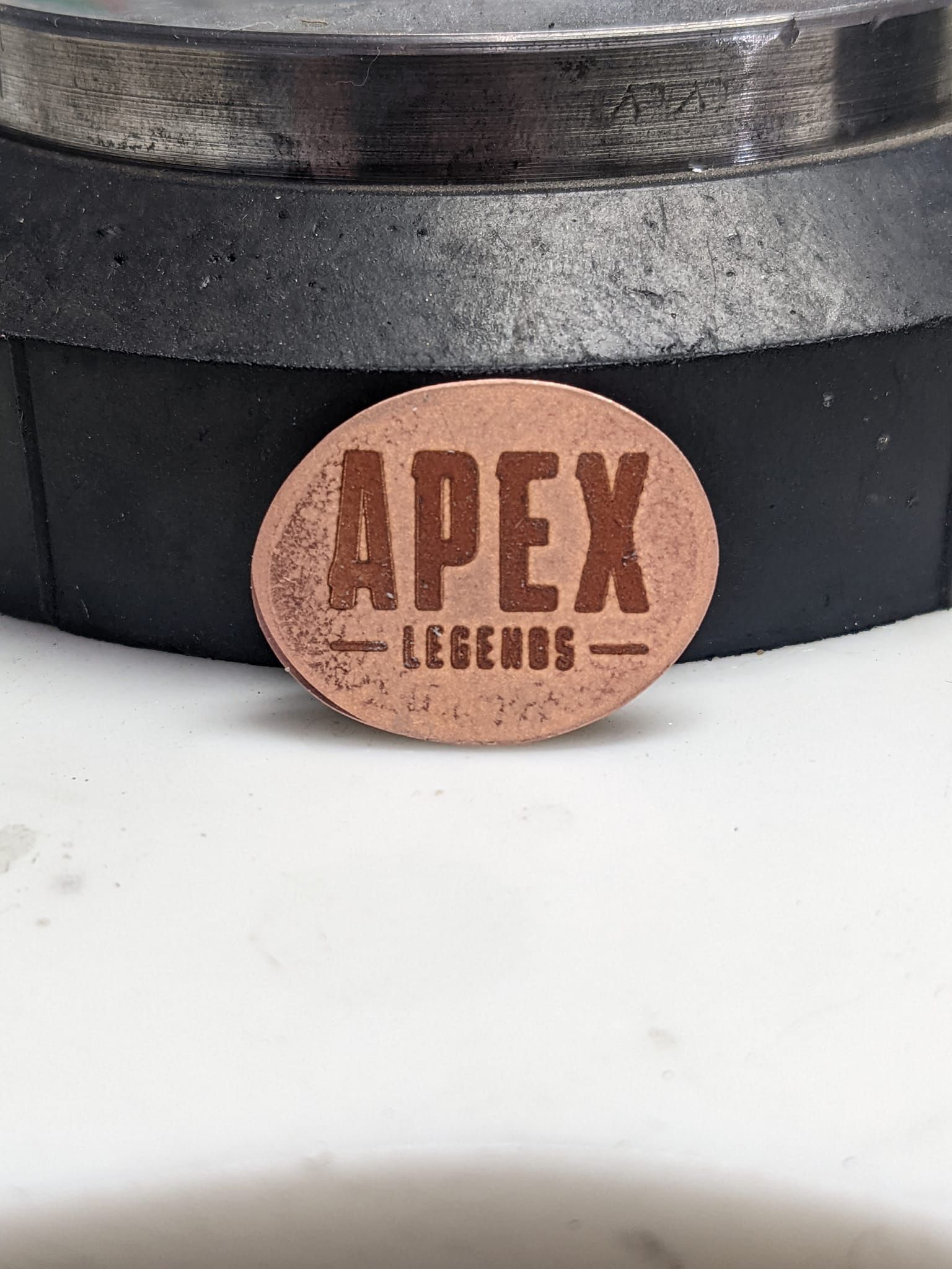 A brown circle with apex legends written on it