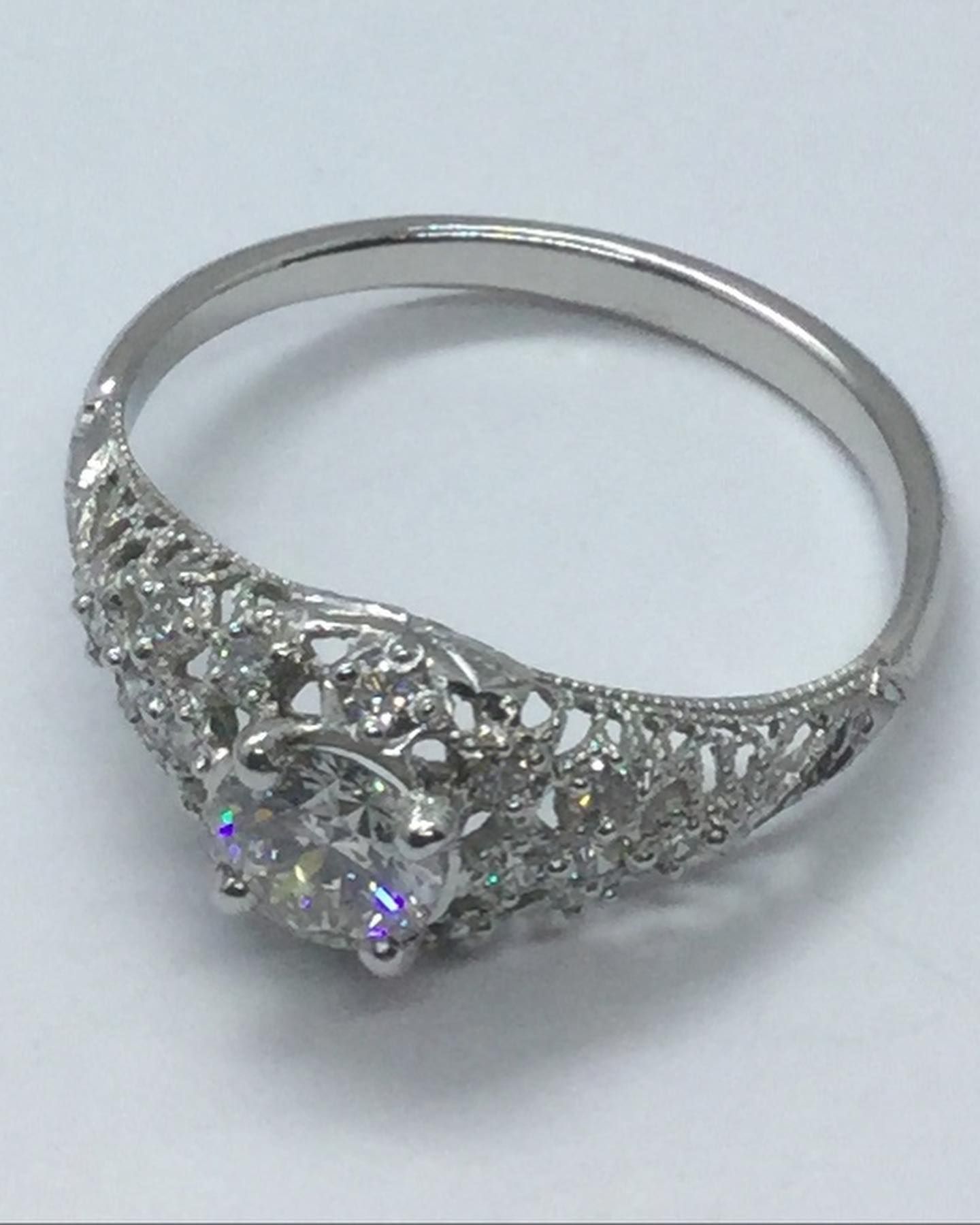 A silver ring with a diamond in the center