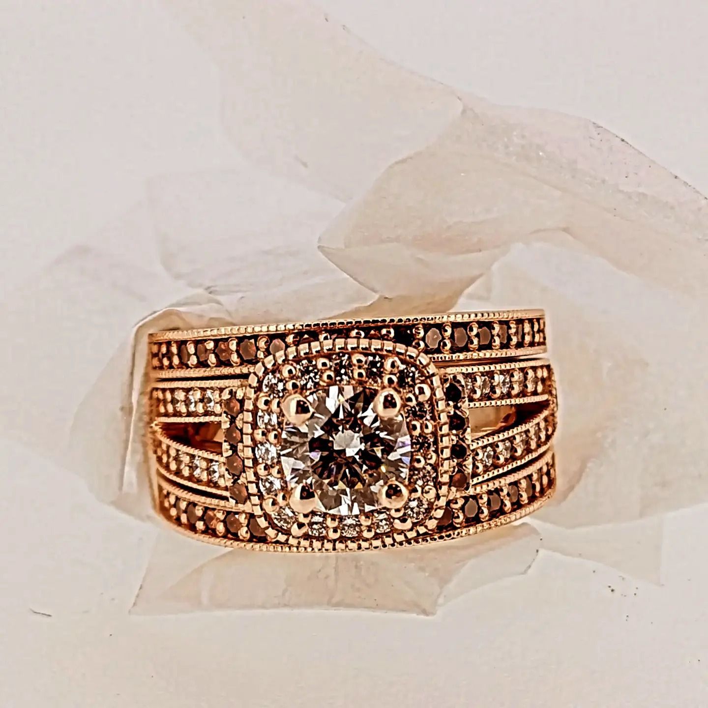 A gold ring with a diamond in the center