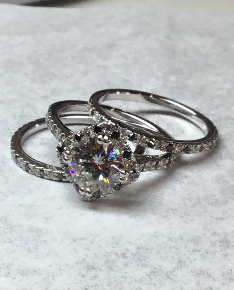 Three rings are stacked on top of each other on a white surface