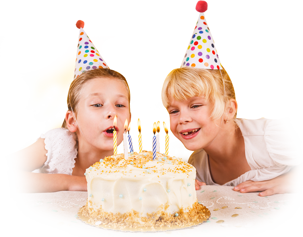 two kids in front of a birthday cake