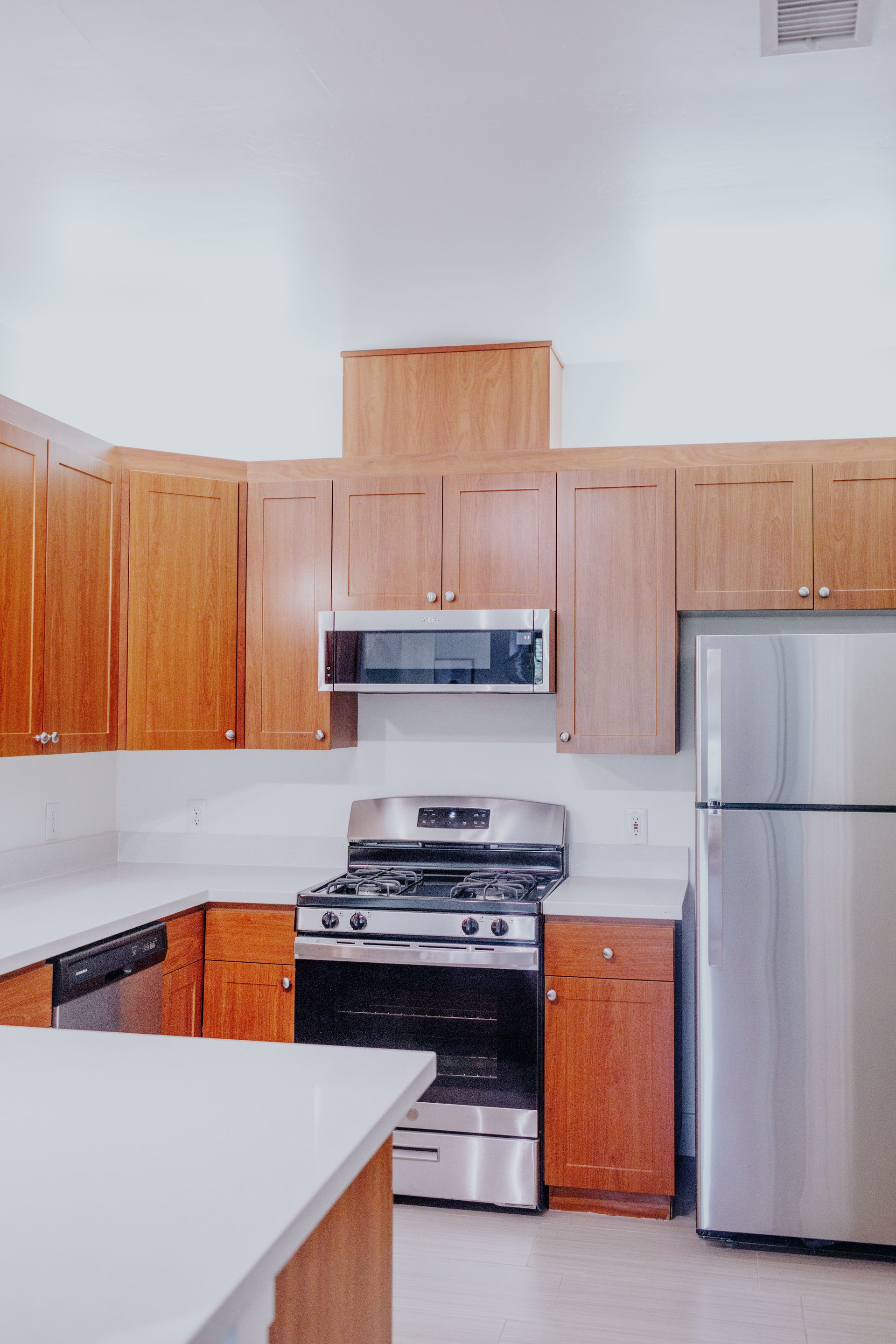 Modern kitchen with stainless steel appliances and sleek design.