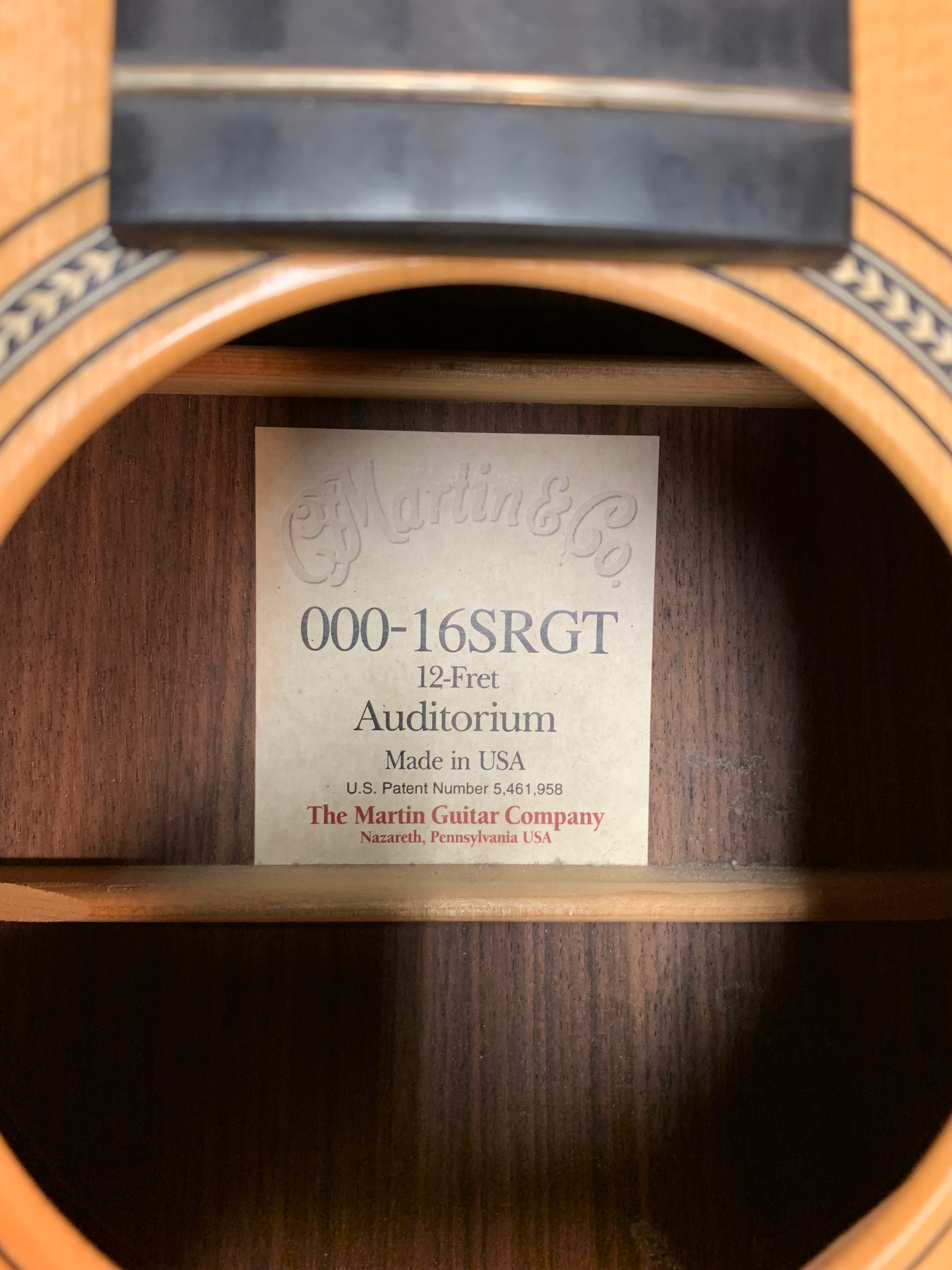 Label inside a Martin 000-16SGT acoustic guitar, with model details, factory information.
