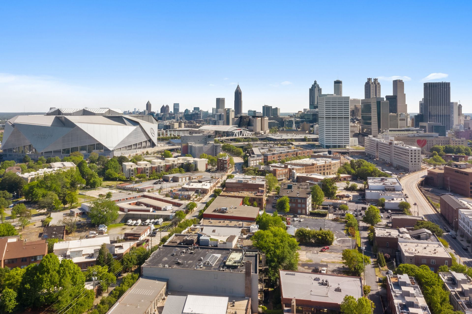 An aerial view of a city with a lot of buildings and trees.