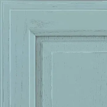 Blue cabinet door with distressed finish.