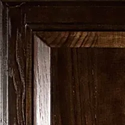 Dark wooden cabinet corner with carved details.