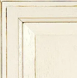Cream-colored, distressed cabinet door showing the panel and frame.