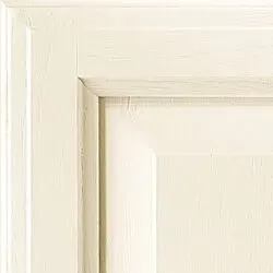 Cream-colored painted door corner showing panel and trim details.