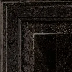 Dark stained wooden cabinet door detail, showcasing wood grain texture.
