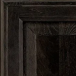 Close-up of a dark stained wood cabinet door. Textured grain visible, with recessed panel and detailed edges.