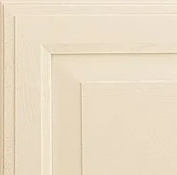 Cream-colored cabinet door detail with recessed panel and layered trim.