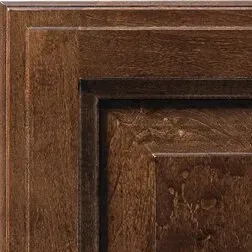 Brown wood cabinet door with raised panel detail.
