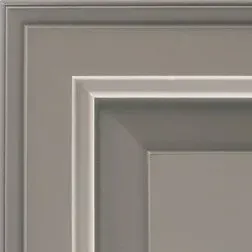 Close-up of a light gray, beveled, framed cabinet door corner.