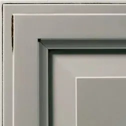Corner of a gray framed artwork with a white border, showcasing a clean, modern aesthetic.