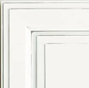 White painted cabinet corner showing layered molding.