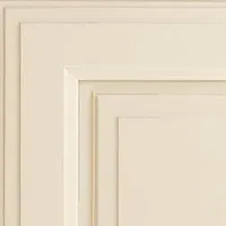 Corner of cream-colored paneling with layered trim.