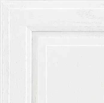 White cabinet door detail with layered, rectangular molding.