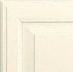 Off-white cabinet door with a recessed panel and decorative frame.