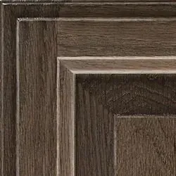Close-up of a wood cabinet door, featuring a dark brown grain pattern with layered panel details.