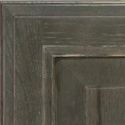 Dark green wood cabinet door detail.