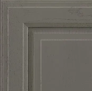 Gray cabinet door, with a recessed center panel and layered frame detail.