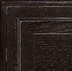 Close-up of a dark brown, textured wood panel, showing detailed grain and trim.
