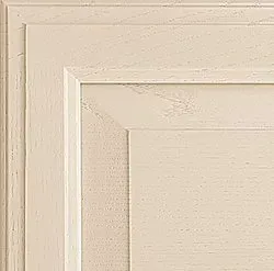 Cream-colored wooden cabinet door with recessed panel and layered frame, close-up detail.