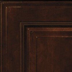 Close-up of a dark brown, raised panel cabinet door.