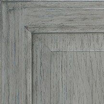 Close-up of a gray, textured wooden cabinet door, showcasing its grain and paneling details.